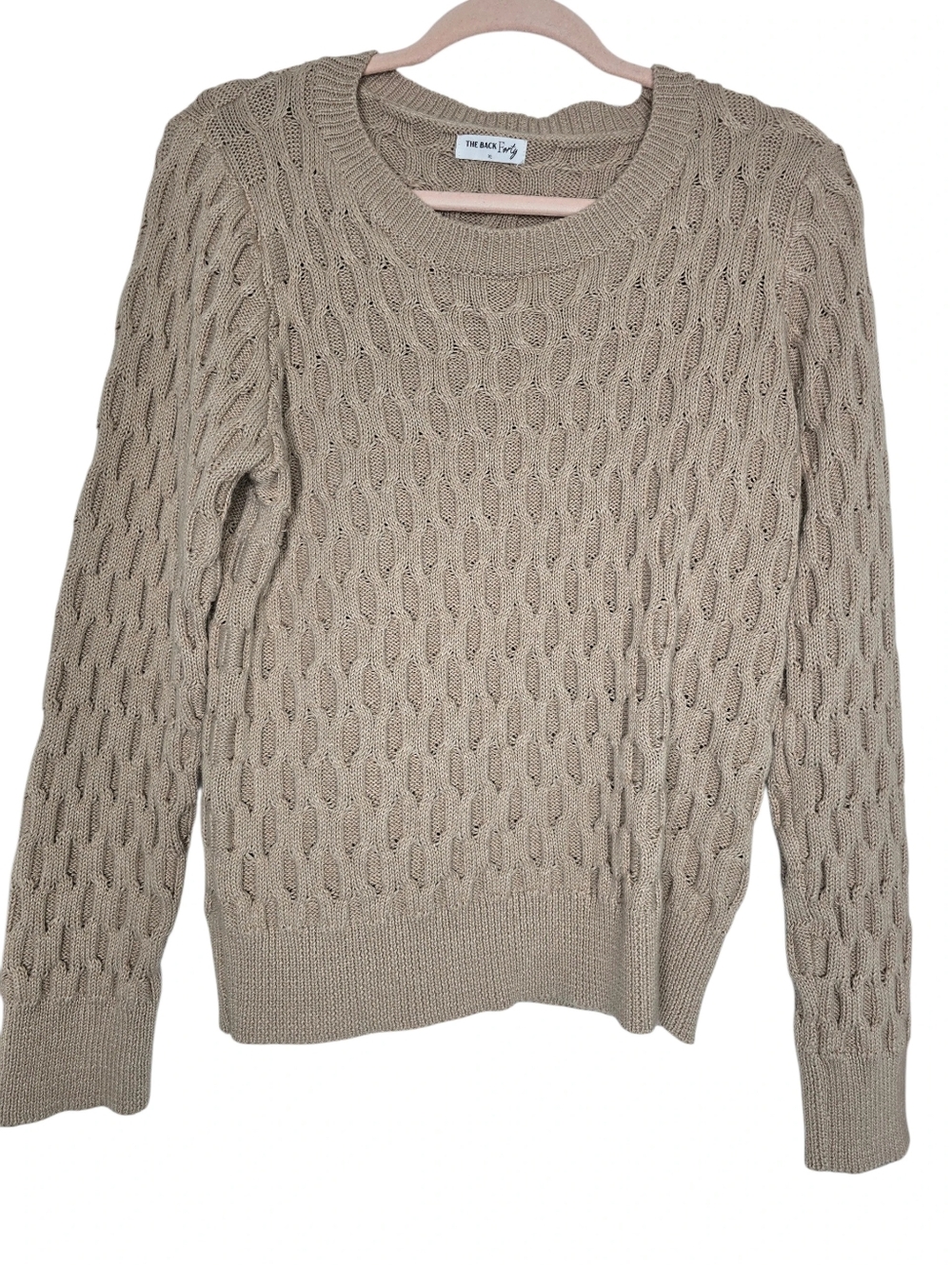 Beige cable-knit sweater from The Back Forty